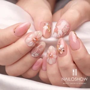 Korean jelly nails with intricate floral designs, glitter accents, and a mix of soft pink and translucent finishes.